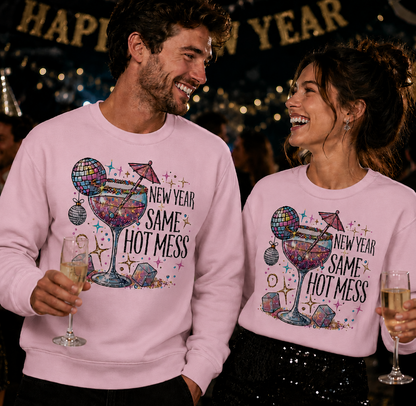 Two people wearing matching light pink sweatshirts with "New Year Same Hot Mess" Graphic Design