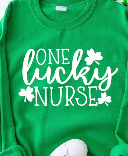 One Lucky Nurse graphic t-shirt with white ink design for St. Patrick’s Day