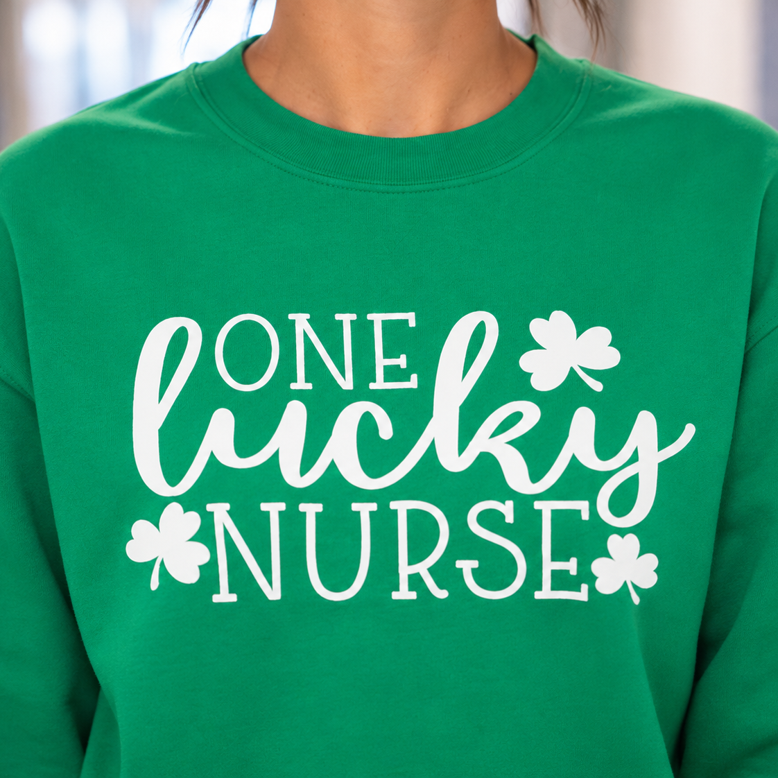 Close up of the OneLucky Nurse graphic design on a sweatshirt