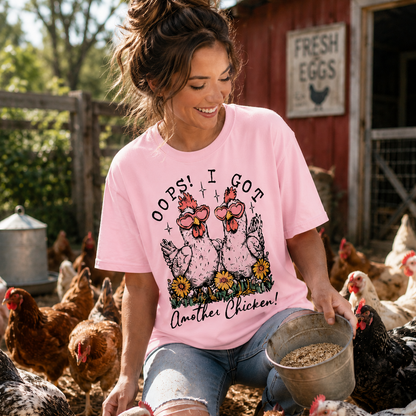 Woman in pink shirt with chicken graphic and text oops I got another chicken