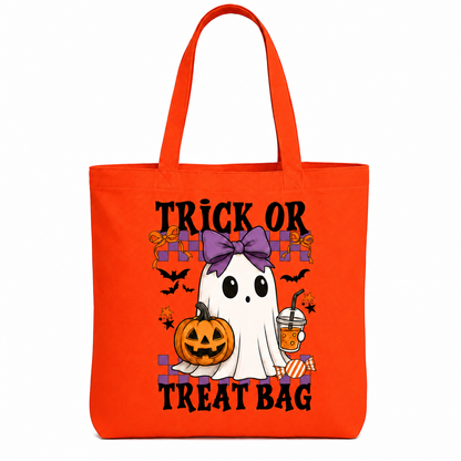 A bright orange canvas tote bag with a Halloween graphic featuring a cartoon ghost, pumpkin, bats, and the text 'TRICK OR TREAT BAG'.