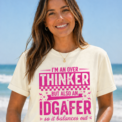 Woman wearing a graphic t-shirt with a humorous text design on a beach