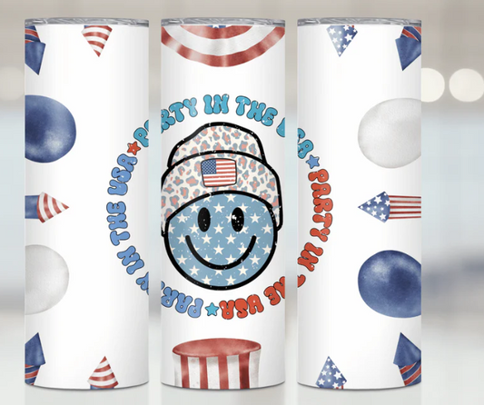 20 Oz Tumbler with a patriotic design featuring balloons, an American flag, and a smiling face.
