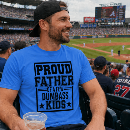 Man wearing a heather royal blue graphic t-shirt with text "Proud Father of a few dumbass kids at a baseball game