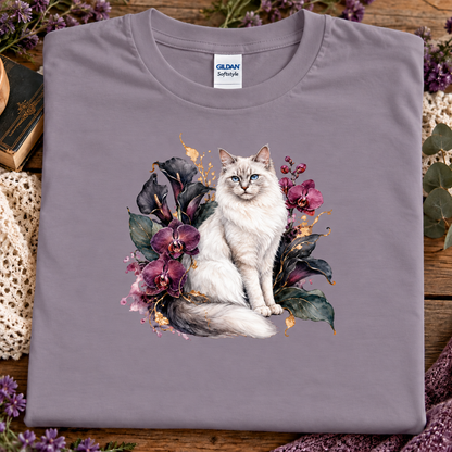 A paragon colored t-shirt with a ragdoll Cat surrounded by a velvet garden of orchids.