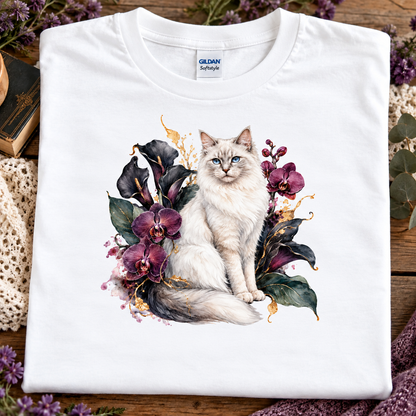 A white t-shirt with a ragdoll Cat surrounded by a velvet garden of orchids.