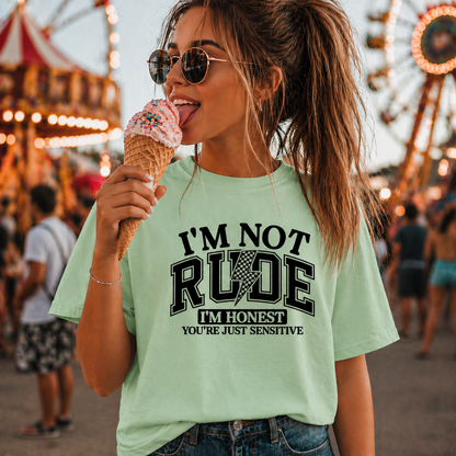Woman eating ice cream at a fair wearing a mint green colored t-shirt with humorous text.