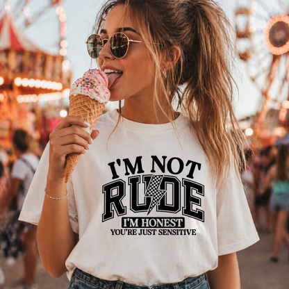 Woman wearing a white t-shirt with text and eating an ice cream cone at a fair.