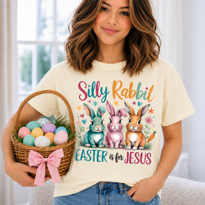 Girl wearing a ivory colored t-shirt with a Silly Rabbit Easter is for Jesus text graphic design with rabbits