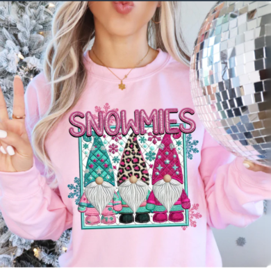 Christmas sweatshirt featuring “Snowmies” in faux embroidery, surrounded by gnomes in colorful snowsuits, cozy and festive for holiday wear.