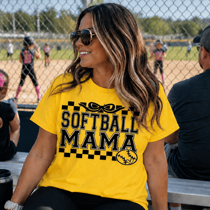 Woman wearing a 'Softball Mama' daisy colored graphic t-shirt.