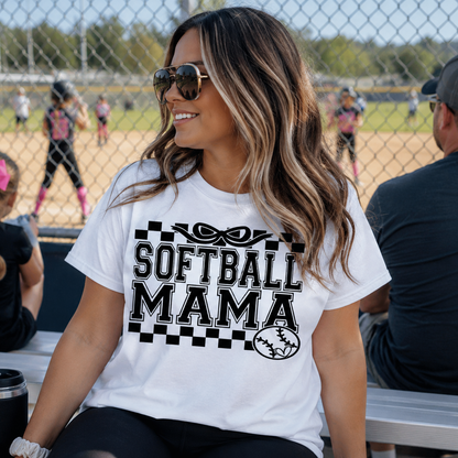 Woman wearing a 'Softball Mama' white graphic t-shirt.