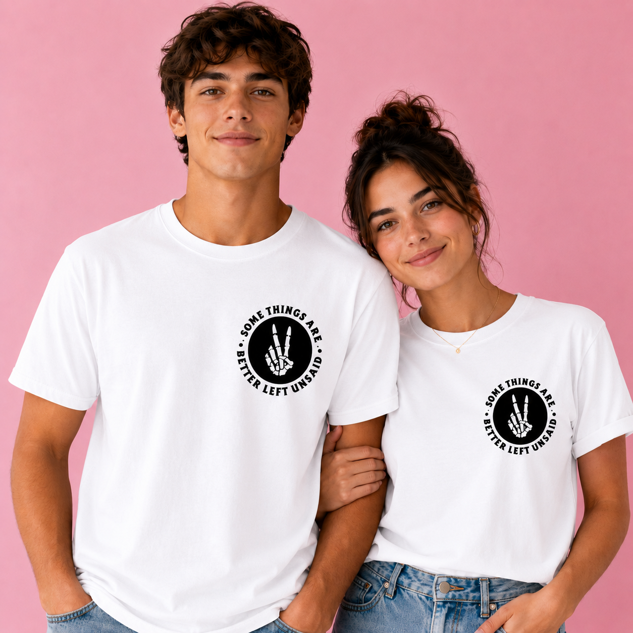Two people wearing white t-shirts with a black graphic and text on a pink background