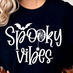 Black t-shirt with 'Spooky Vibes' text and Halloween-themed graphics.