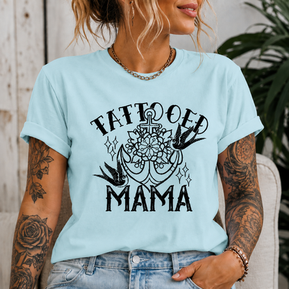 Woman wearing a chambray colored t-shirt with Tattooed Mama Graphic design