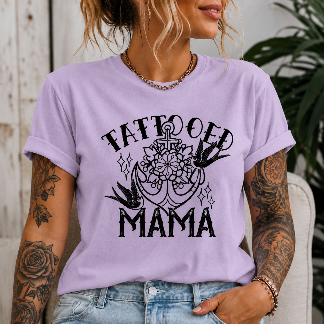 Woman wearing an orchid t-shirt with Tattooed Mama Graphic design