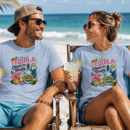 A man and a woman sitting on beach chairs at the ocean, both wearing matching light blue graphic T-shirts with a colorful 'Tequila Cleaner and Therapist' design featuring bottles, flowers, and tropical elements.