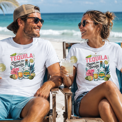 A man and a woman sitting in beach chairs on a sunny beach, both wearing matching white graphic t-shirts with a colorful 'Tequila Cheers and Therapy' tropical design.