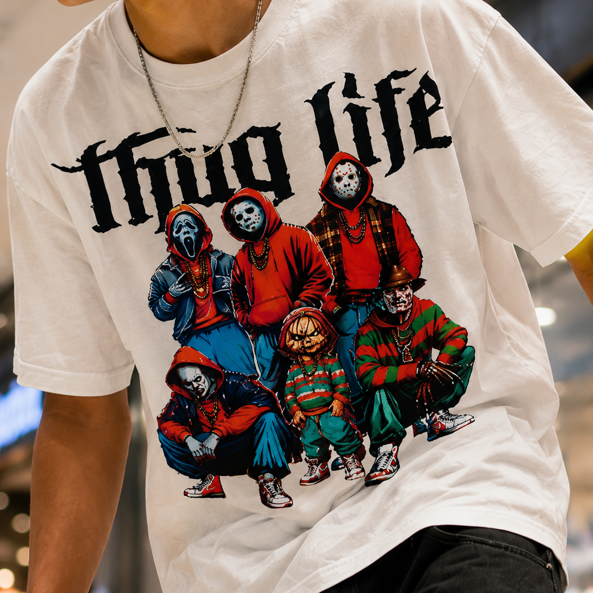 White t-shirt with graphic design and text 'Thug Life' worn by a person.