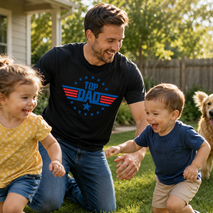 Man wearing a 'Top Dad' on a black colored t-shirt with two children and a dog in a backyard.