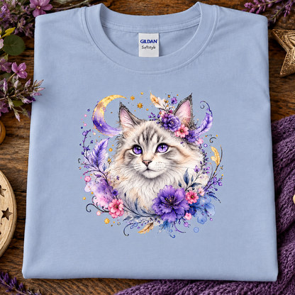 A light blue t-shirt with a silver tabby cat wrapped in colorful flowers graphic.