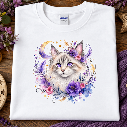 A white t-shirt with a silver tabby cat wrapped in colorful flowers graphic.