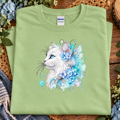 A pistachio green colored T-Shirt with a white cat surrounded by flowers