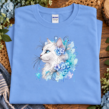 A carolina blue colored T-Shirt with a white cat surrounded by flowers