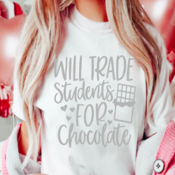 “Will Trade Students for Chocolate” funny teacher text graphic printed on a t-shirt.