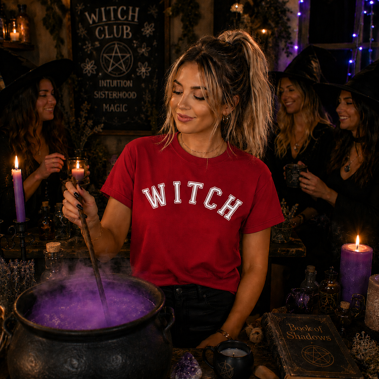 Woman in a red 'WITCH' shirt stirring a purple potion in a cauldron with Halloween decorations in the background.