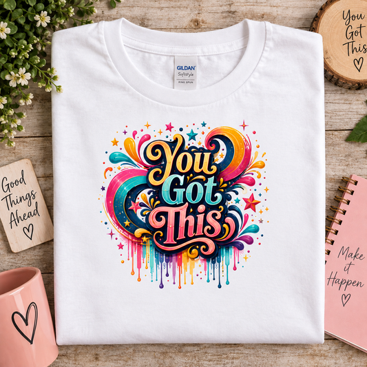 White gildan t-shirt with a bright colored graphic with the words You Got This