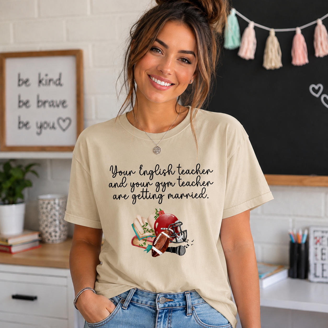Women wearing a sand colored t-shirt with the text Your english teacher and your gym teacher are getting married with a graphic design