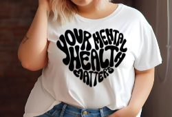 “Your Mental Health Matters” phrase arranged in a heart shape printed on a graphic t-shirt.