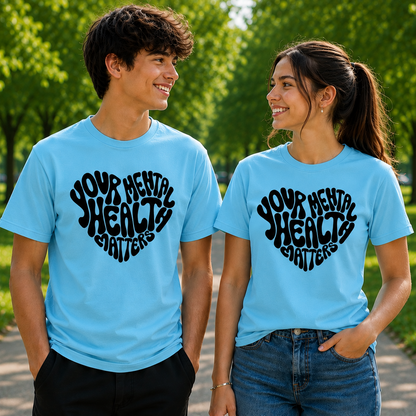 Two people wearing blue t-shirts with 'Your Mental Health Matters' text in a park.