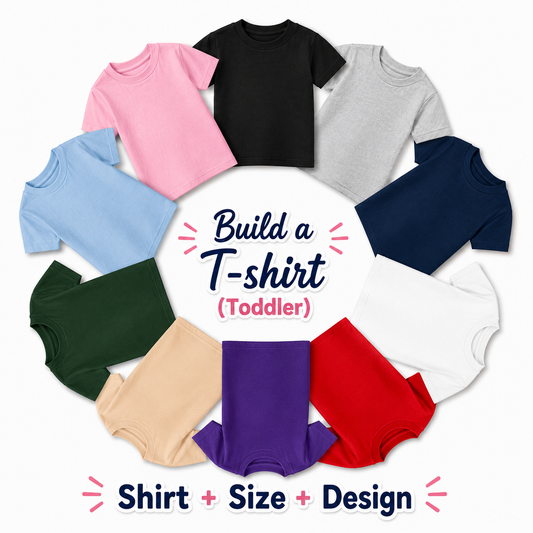 A circular collage showing multiple toddler short-sleeve T-shirts in different colors, including pink, black, gray, light blue, navy, dark green, beige, purple, white, and red, arranged around a central text label that reads 'Build a T-shirt (Toddler)'.