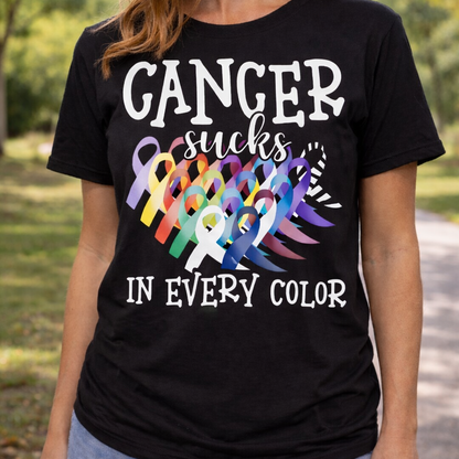 Shop Cancer Sucks in All Colors graphic t-shirt. Bold cancer awareness ribbon design perfect for events, fundraisers, and everyday support wear.